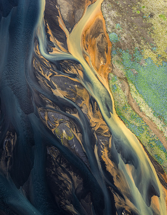dream-like landscape with flowing rivers, taken from a helicopter