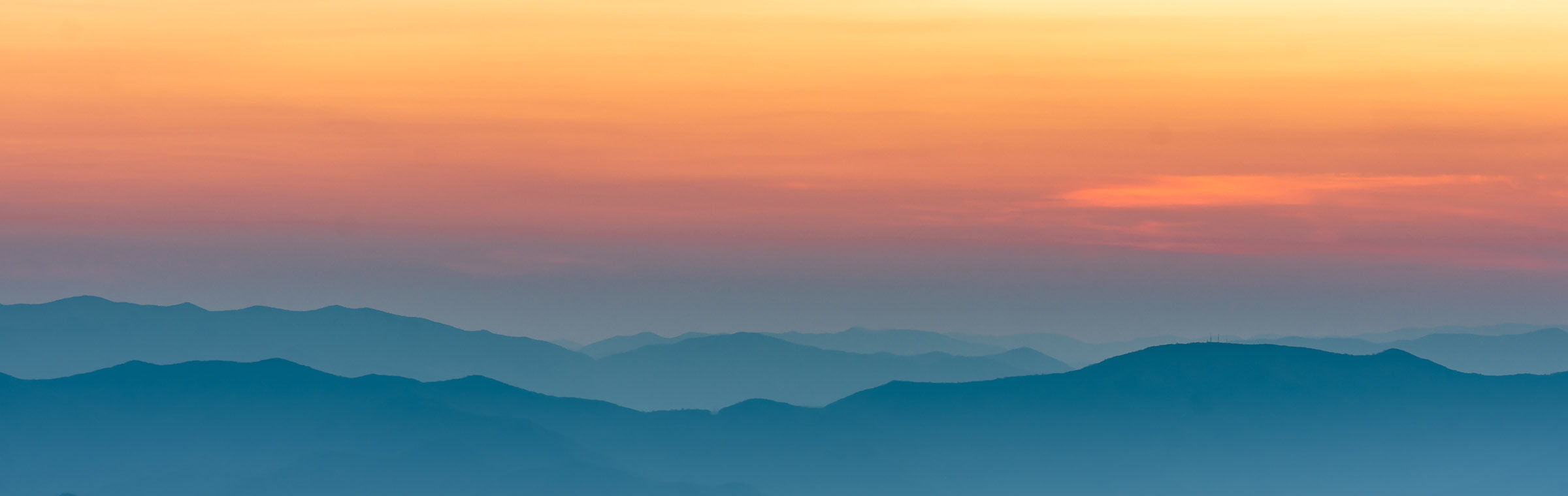 orange sunset over the blue ridge mountains