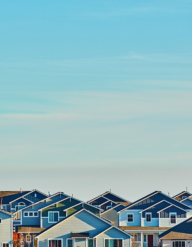 residential housing with a blue sky background