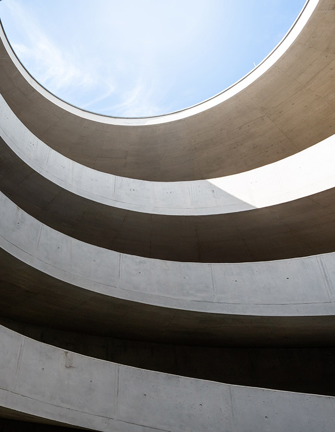 driveway in a parking garage with a lot of curves