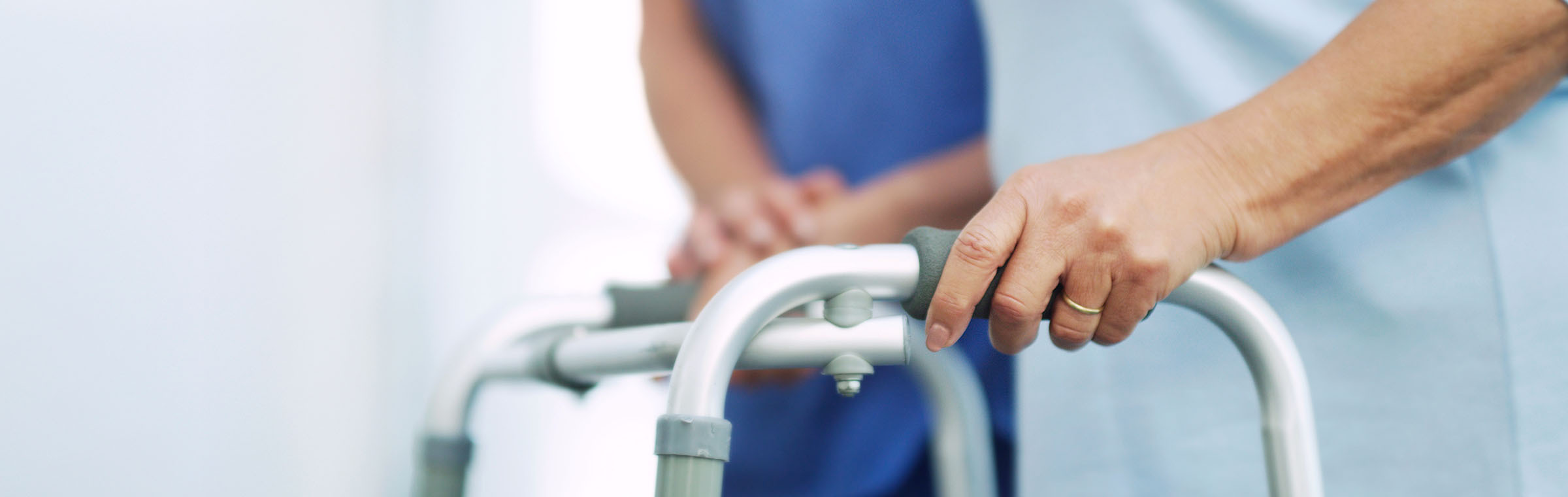 senior woman holding a walker