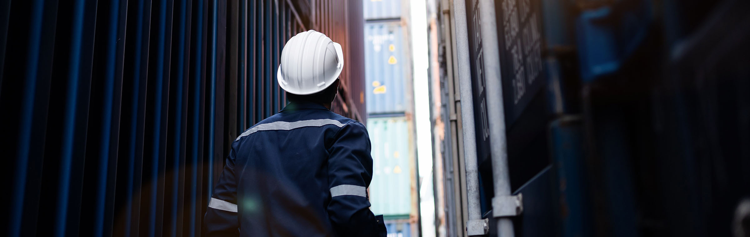 worker standing in a container yard