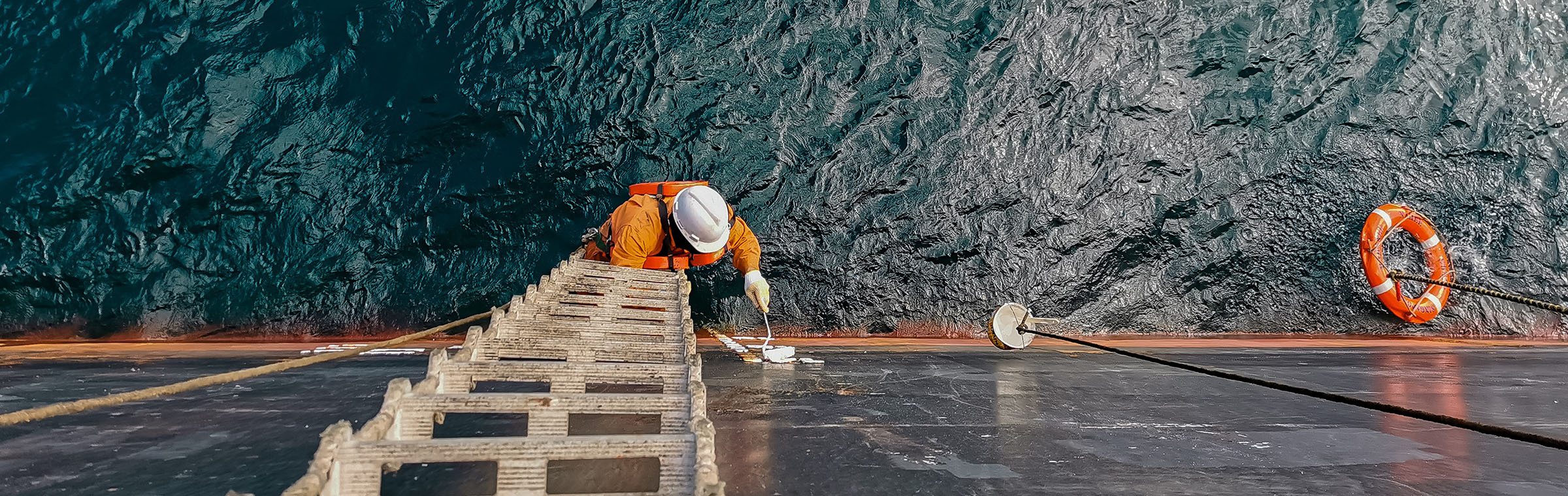 ship crew repairing a cargo ship or bulk carrier