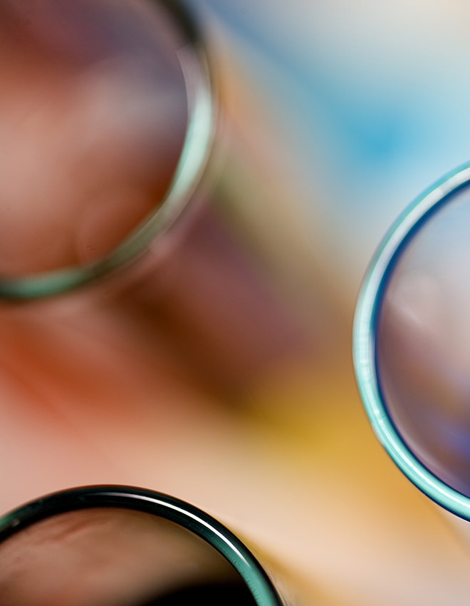 colorful beakers on a blurred background