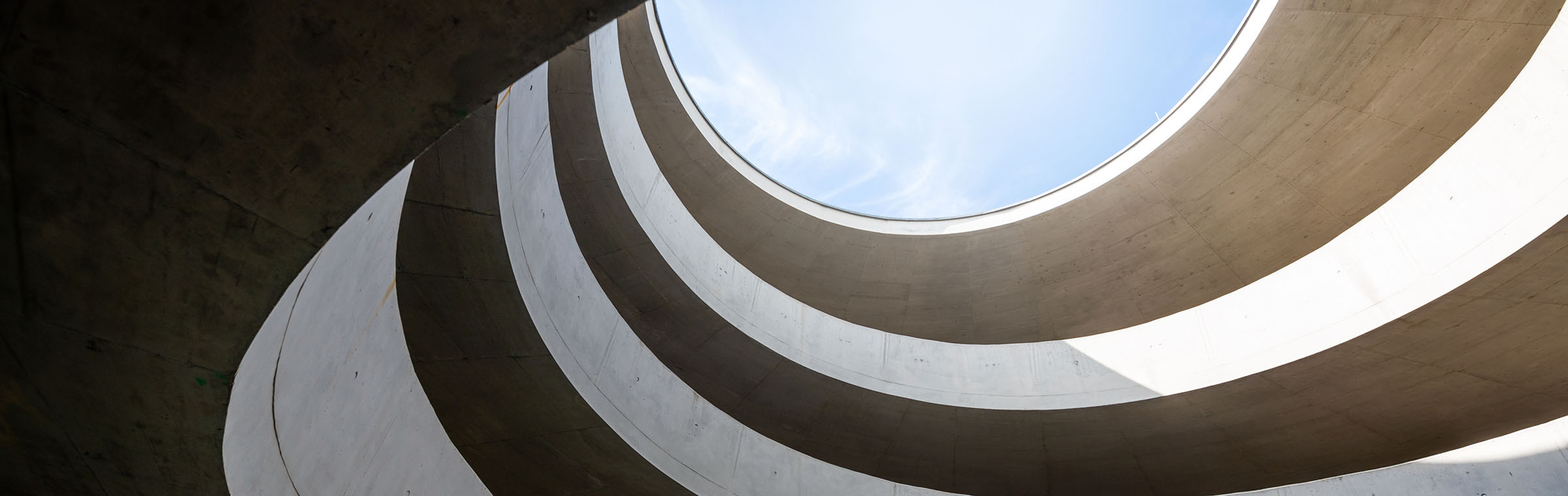 driveway in a modern parking garage with a lot of curves